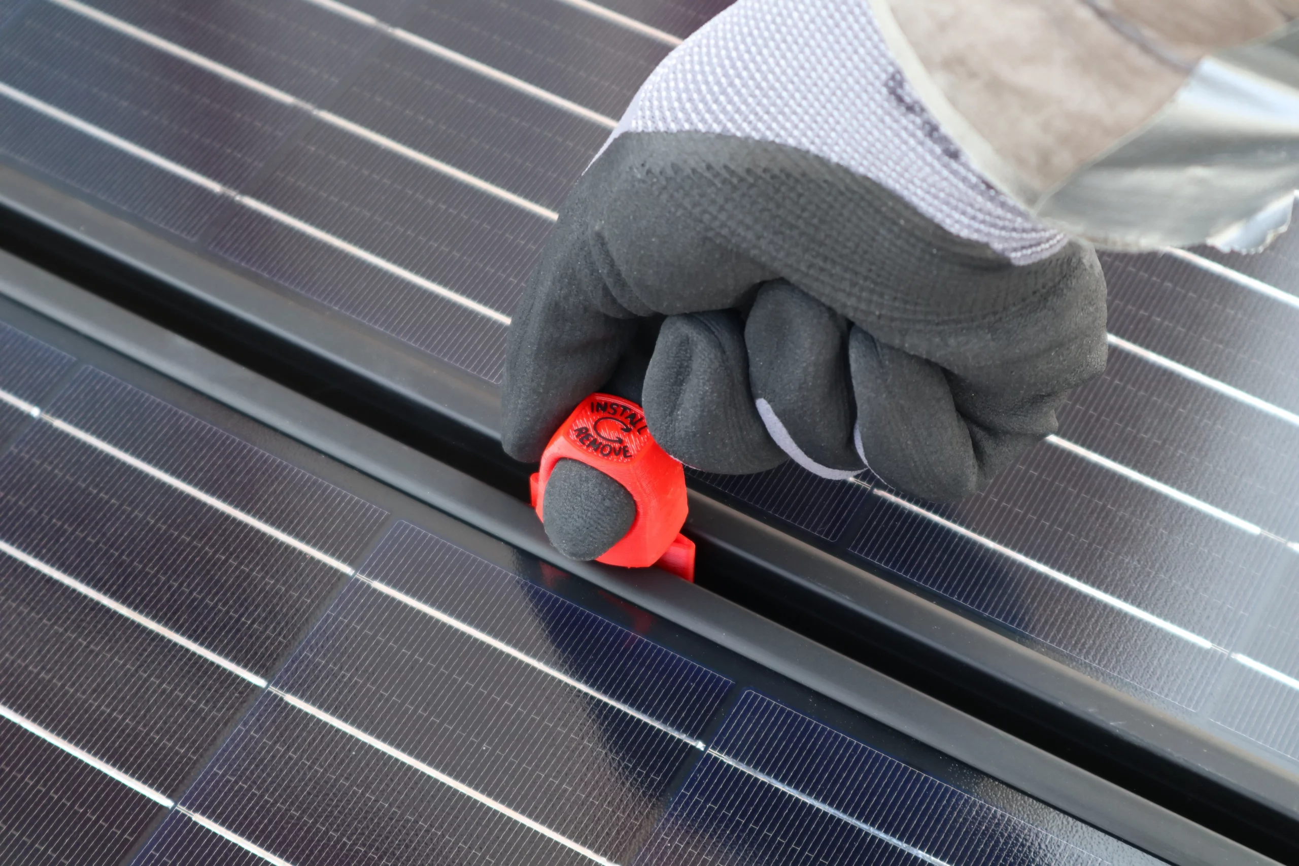 mod spacer between two solar panels with hand