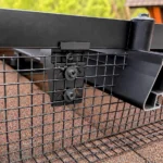 Clip attaching wire mesh critter fencing to solar panel with ironridge racking